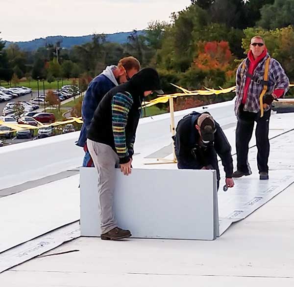 commercial roofing contractors hard at work